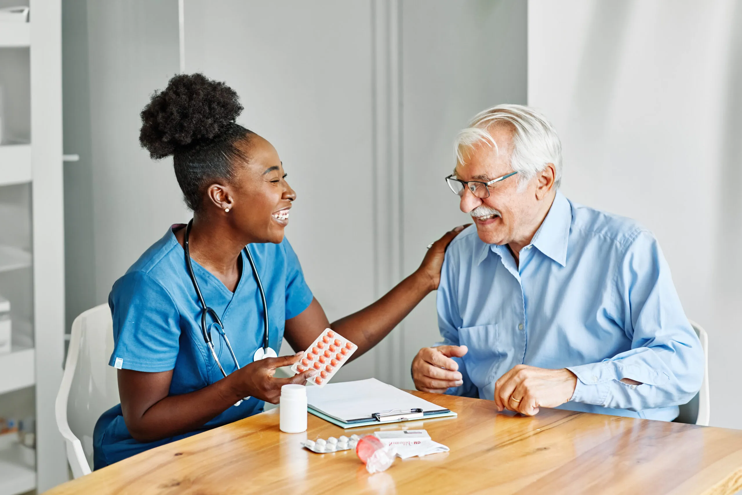Caregiver assisting elderly woman in San Antonio home